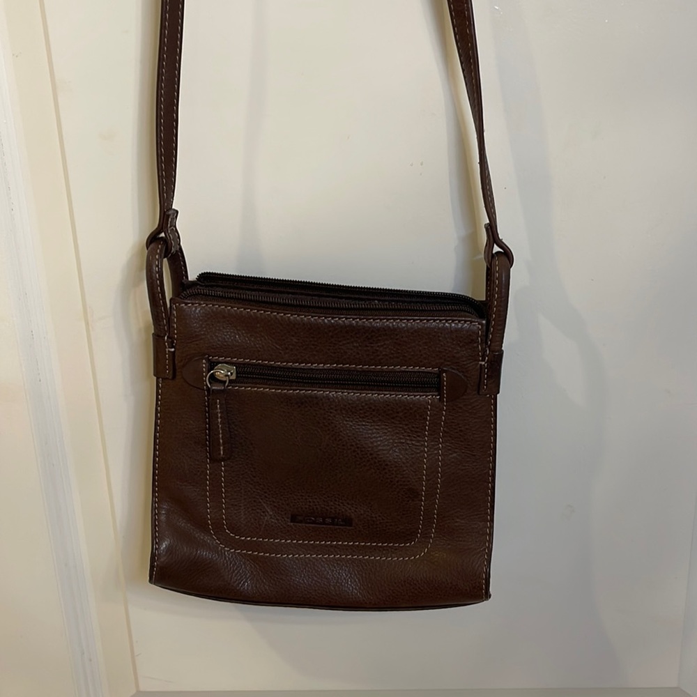 Brown leather fossil bag.